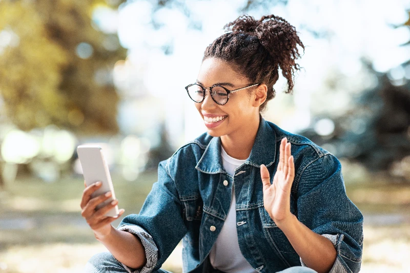 Happy woman using smartphone