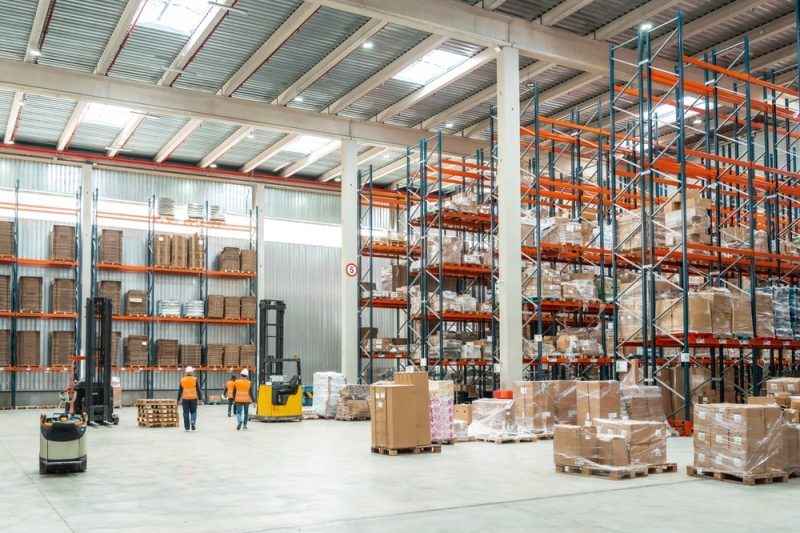 Warehouse,Workers,Are,Managing,Logistics,,Operating,Forklifts,,And,Organizing,Packages